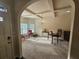 Inviting living room with coffered ceiling, chandelier, and natural light at 1750 Stone Meadow Rd, Lithonia, GA 30058