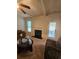 Cozy living room with fireplace and ceiling fan, perfect for relaxing and entertaining at 1750 Stone Meadow Rd, Lithonia, GA 30058