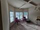 Bright living room with natural light, stylish seating, and elegant chandelier at 1750 Stone Meadow Rd, Lithonia, GA 30058