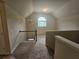Spacious loft area featuring a chandelier and a window at 1750 Stone Meadow Rd, Lithonia, GA 30058