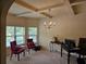 Bright office featuring coffered ceilings, carpeted floors, and large windows at 1750 Stone Meadow Rd, Lithonia, GA 30058