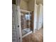 Walk-in shower with glass door and tile surround at 1750 Stone Meadow Rd, Lithonia, GA 30058