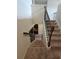 Carpeted staircase with decorative wrought iron railings at 1750 Stone Meadow Rd, Lithonia, GA 30058