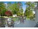 Inviting back deck with outdoor seating, overlooking a lush backyard and storage shed at 1953 Windcrest Sw Dr, Lilburn, GA 30047