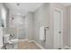 Bathroom featuring a walk-in shower with elegant tile work and natural light at 1953 Windcrest Sw Dr, Lilburn, GA 30047
