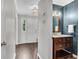 Stylish powder room featuring a modern vanity and elegant fixtures at 1953 Windcrest Sw Dr, Lilburn, GA 30047
