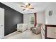 Bedroom bedroom with modern design, rocking chair, and comfortable crib at 1953 Windcrest Sw Dr, Lilburn, GA 30047