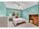 Cozy bedroom with natural light from the window, perfect for relaxation at 1953 Windcrest Sw Dr, Lilburn, GA 30047