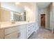 Bright bathroom with double vanity, quartz countertop, and tiled shower at 4082 Adler Cir, Buford, GA 30519