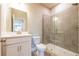 Bathroom featuring a glass-enclosed shower and a modern vanity with neutral gray color tones at 4082 Adler Cir, Buford, GA 30519