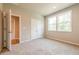 Bright bedroom featuring a double closet, two windows and neutral colored carpet at 4082 Adler Cir, Buford, GA 30519