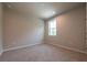 Bright bedroom with plush carpeting and large window offering natural light at 4082 Adler Cir, Buford, GA 30519