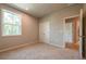 Bedroom with neutral carpet and large windows for natural light at 4082 Adler Cir, Buford, GA 30519