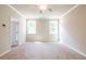 Bedroom with neutral decor, ceiling fan, and natural light from two windows at 4082 Adler Cir, Buford, GA 30519