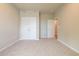 Neutral bedroom featuring a double-door closet and carpet flooring at 4082 Adler Cir, Buford, GA 30519