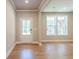 Inviting foyer with wood floors, recessed lighting, and neutral wall colors, enhancing the home's welcoming atmosphere at 4082 Adler Cir, Buford, GA 30519