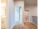 Bright hallway featuring hardwood floors and views into the bedroom and bathroom at 4082 Adler Cir, Buford, GA 30519