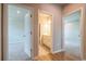Hallway featuring doors leading to bedroom and bathroom with hardwood floors at 4082 Adler Cir, Buford, GA 30519