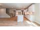Spacious kitchen featuring white cabinets, stainless steel appliances, island, and hardwood floors at 4082 Adler Cir, Buford, GA 30519