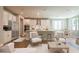 Cozy open concept kitchen with breakfast bar, stainless steel appliances, and adjacent living space at 4082 Adler Cir, Buford, GA 30519