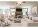 Inviting living room with fireplace, and modern decor creates a cozy and stylish space for relaxation and entertainment at 4082 Adler Cir, Buford, GA 30519