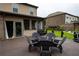 Comfortable back patio with seating and views of a landscaped garden at 552 Warrenton Run Dr, Sugar Hill, GA 30518