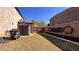Backyard featuring a shed, lawn, mulched garden bed and privacy fence at 552 Warrenton Run Dr, Sugar Hill, GA 30518