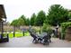 Serene backyard with stone water feature, manicured landscaping, and outdoor seating area at 552 Warrenton Run Dr, Sugar Hill, GA 30518