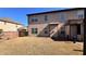 Exterior view of the home showcasing the backyard and outdoor space, and wooden fence at 552 Warrenton Run Dr, Sugar Hill, GA 30518