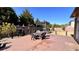 Backyard patio featuring outdoor dining and relaxing area surrounded by greenery at 552 Warrenton Run Dr, Sugar Hill, GA 30518