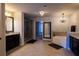 Bathroom featuring tile floor, dark cabinetry, and glass shower at 552 Warrenton Run Dr, Sugar Hill, GA 30518