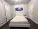 Bright bedroom featuring neutral walls, a queen-sized bed, and minimalist decor at 552 Warrenton Run Dr, Sugar Hill, GA 30518