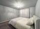 Bedroom featuring a white bed set, curtains, and a ceiling chandelier at 552 Warrenton Run Dr, Sugar Hill, GA 30518