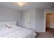 Well-lit bedroom featuring a cozy bed, and modern furnishings at 552 Warrenton Run Dr, Sugar Hill, GA 30518