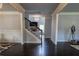 Spacious entryway featuring hardwood floors, staircase, and decorative chandelier leading into the living spaces at 552 Warrenton Run Dr, Sugar Hill, GA 30518