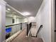 Hallway featuring plush carpet, a view of the living room and modern lighting at 552 Warrenton Run Dr, Sugar Hill, GA 30518