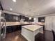 Gourmet kitchen with granite countertops, stainless steel appliances, and a large island at 552 Warrenton Run Dr, Sugar Hill, GA 30518