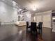 Bright living room boasts hardwood floors, soaring ceilings and contemporary chandelier lighting at 552 Warrenton Run Dr, Sugar Hill, GA 30518