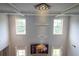 Spacious living room with high ceilings, statement lighting, and large windows providing natural light at 552 Warrenton Run Dr, Sugar Hill, GA 30518