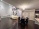Spacious living room with high ceilings, a fireplace, and hardwood floors at 552 Warrenton Run Dr, Sugar Hill, GA 30518