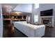 Spacious living room flowing into the kitchen, featuring a fireplace and modern decor for a comfortable living space at 552 Warrenton Run Dr, Sugar Hill, GA 30518