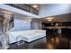 Open concept living area with a view of the kitchen, featuring high ceilings and modern furnishings at 552 Warrenton Run Dr, Sugar Hill, GA 30518