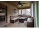 Inviting sunroom features built-in benches, a rustic table, and plenty of natural light at 552 Warrenton Run Dr, Sugar Hill, GA 30518