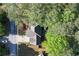 Aerial view of the home nestled among mature trees at 1035 Bridle Path Dr, Lawrenceville, GA 30045