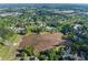 Aerial view of neighborhood pond and surrounding homes at 1035 Bridle Path Dr, Lawrenceville, GA 30045