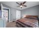 This bedroom features double closets, ceiling fan, neutral paint, and carpet, offering a serene and comfortable space at 1035 Bridle Path Dr, Lawrenceville, GA 30045