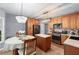 Eat-in kitchen with modern appliances, wood cabinets, and peninsula seating at 1035 Bridle Path Dr, Lawrenceville, GA 30045