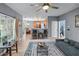 Open living area flowing into the kitchen with modern ceiling fan and decor at 1035 Bridle Path Dr, Lawrenceville, GA 30045