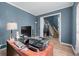 Office featuring a large desk, wood floors, and neutral wall color at 1035 Bridle Path Dr, Lawrenceville, GA 30045