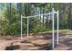 Swing set located within the community, shaded by trees, providing a fun recreational space at 1035 Bridle Path Dr, Lawrenceville, GA 30045